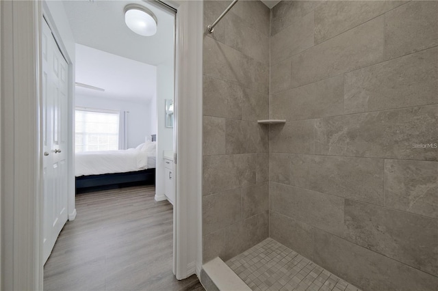 bathroom with a tile shower