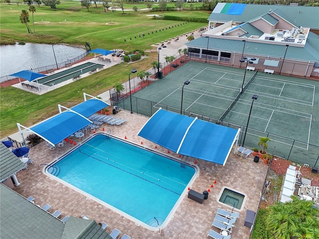 view of pool featuring a water view