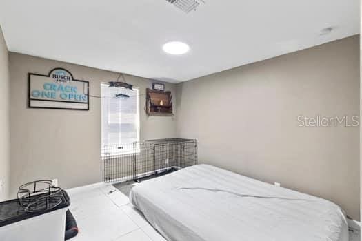 bedroom featuring tile patterned floors