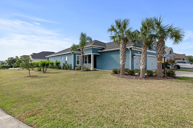 ranch-style home with a front yard and a garage