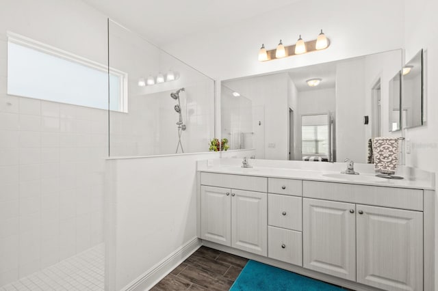 bathroom featuring vanity and tiled shower