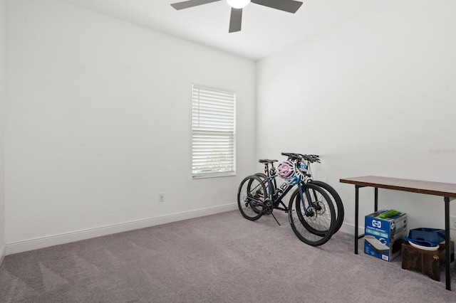 misc room featuring ceiling fan and light colored carpet