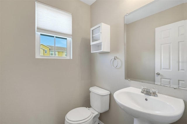 bathroom featuring sink and toilet