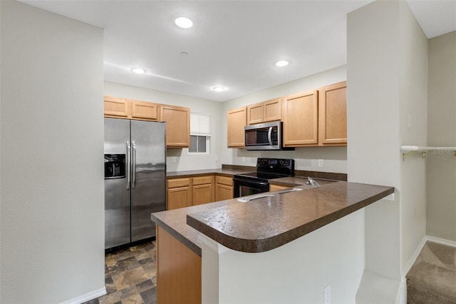 kitchen with sink, light brown cabinets, kitchen peninsula, and appliances with stainless steel finishes