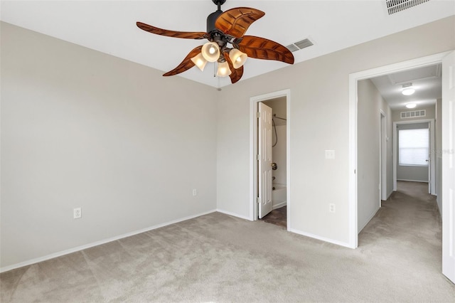 unfurnished bedroom featuring ceiling fan and light carpet