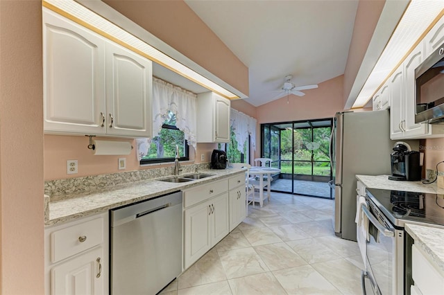 kitchen featuring ceiling fan, sink, white cabinets, and appliances with stainless steel finishes