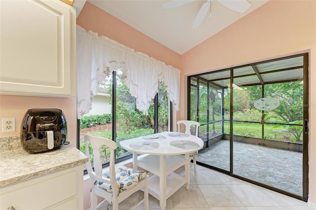 sunroom / solarium featuring ceiling fan and vaulted ceiling