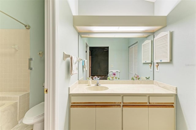 full bathroom with vanity, toilet, and tiled shower / bath combo