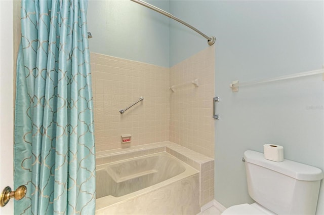 bathroom with shower / tub combo and toilet