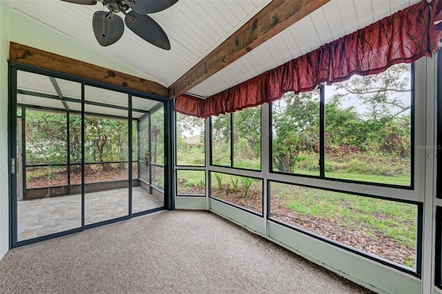 unfurnished sunroom featuring a wealth of natural light, ceiling fan, and lofted ceiling