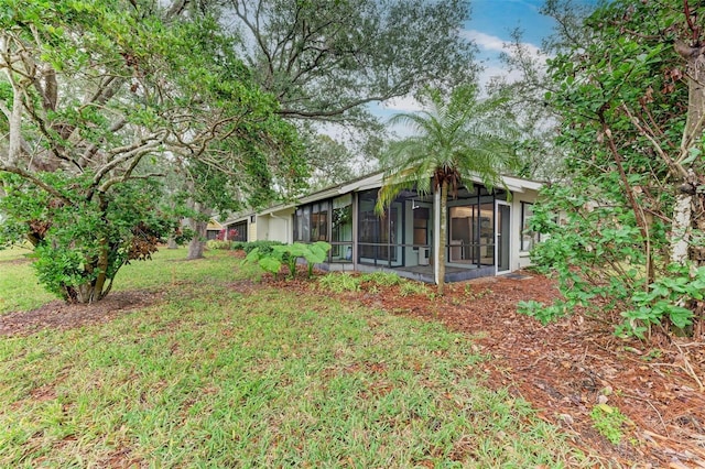 view of yard featuring a sunroom