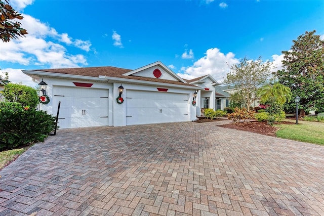 view of front of property with a garage