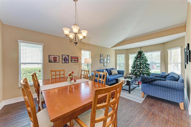 dining space featuring vaulted ceiling, a notable chandelier, and dark hardwood / wood-style floors