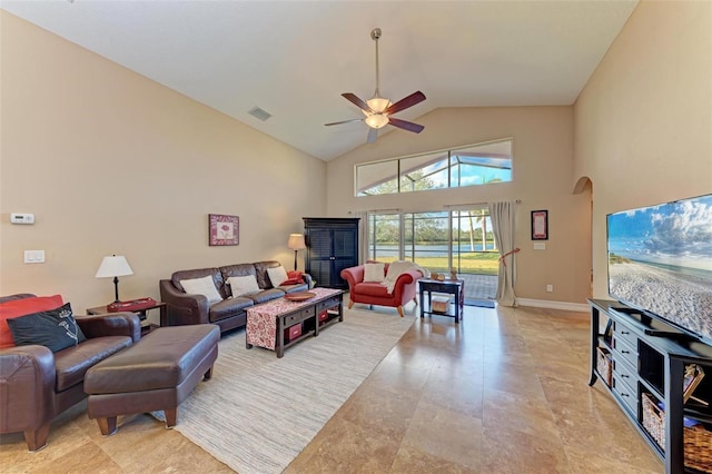 living room with ceiling fan and vaulted ceiling