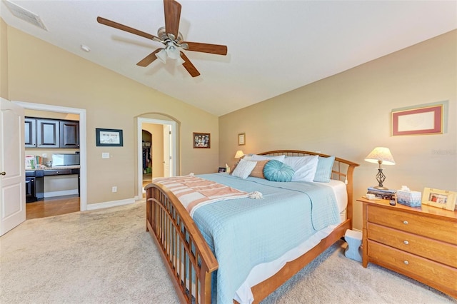 carpeted bedroom with lofted ceiling and ceiling fan