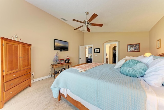 carpeted bedroom featuring lofted ceiling, a walk in closet, and ceiling fan