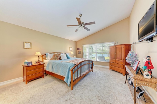 bedroom with vaulted ceiling, ceiling fan, and light carpet