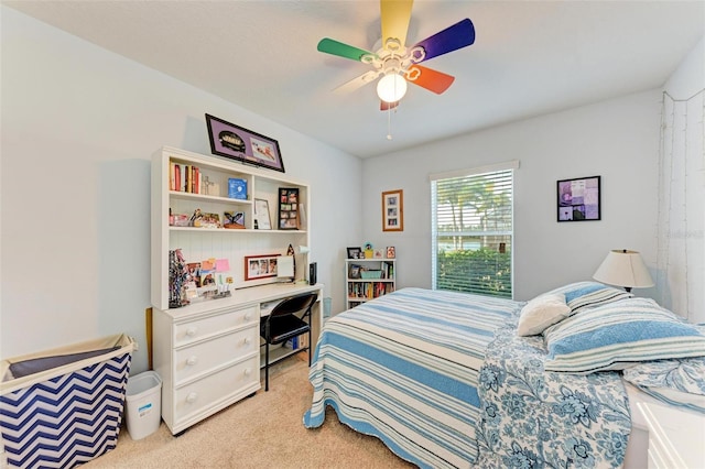 bedroom with ceiling fan and light carpet