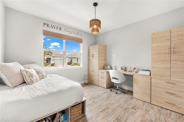 bedroom with light hardwood / wood-style floors