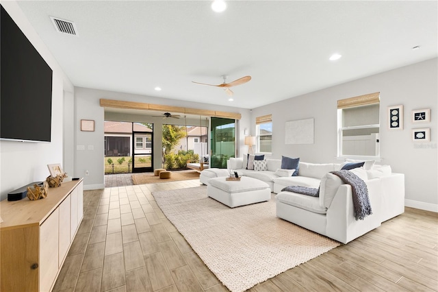 living room featuring ceiling fan