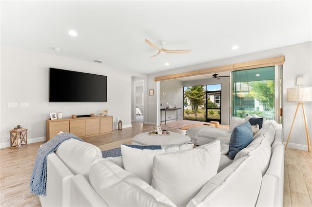 living room with light hardwood / wood-style flooring