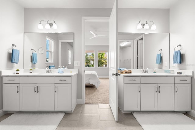 bathroom featuring tile patterned flooring and vanity