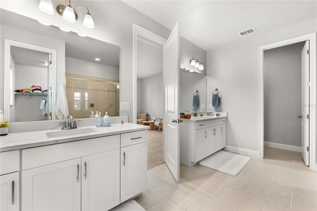 bathroom with vanity, tile patterned floors, and an enclosed shower