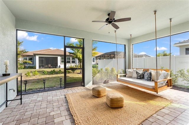 sunroom / solarium with ceiling fan