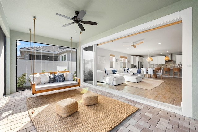 view of patio with ceiling fan and an outdoor hangout area