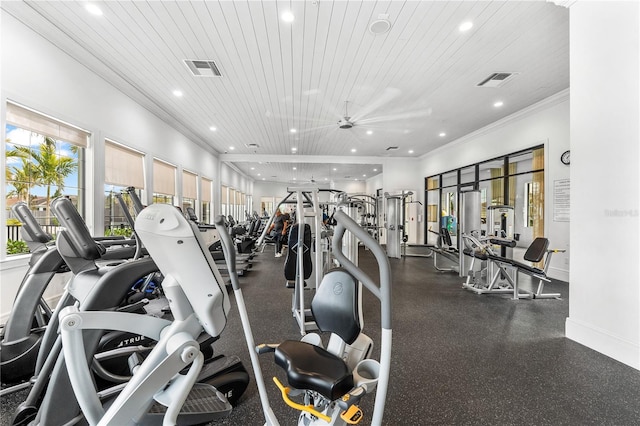 exercise room with ceiling fan, crown molding, and wooden ceiling