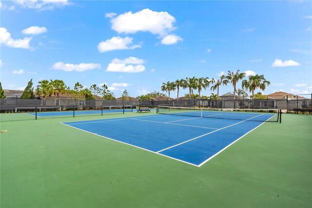 view of sport court with basketball hoop