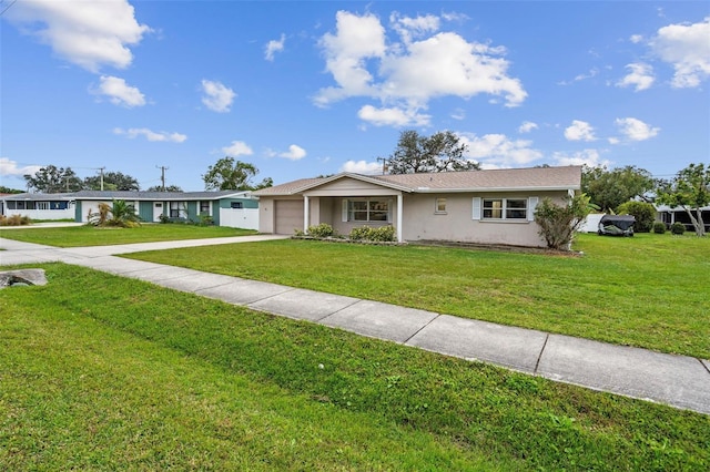 ranch-style house featuring a front lawn and a garage