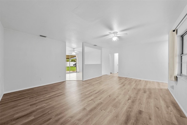 unfurnished living room with ceiling fan and light hardwood / wood-style floors