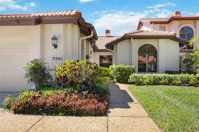 exterior space featuring a front yard and a garage