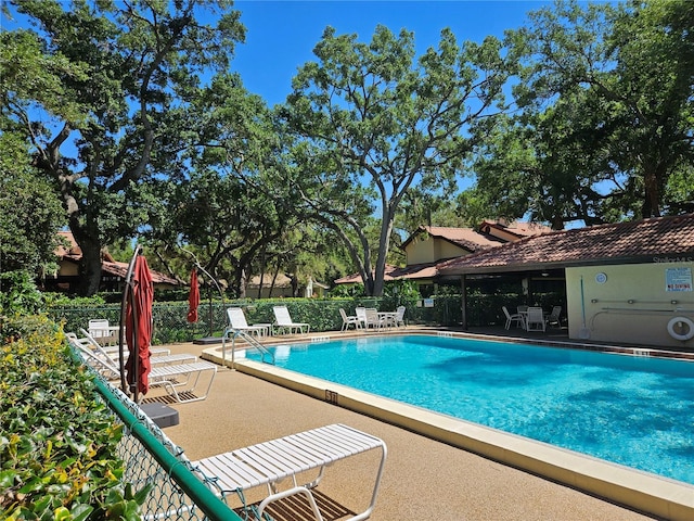 view of pool featuring a patio area