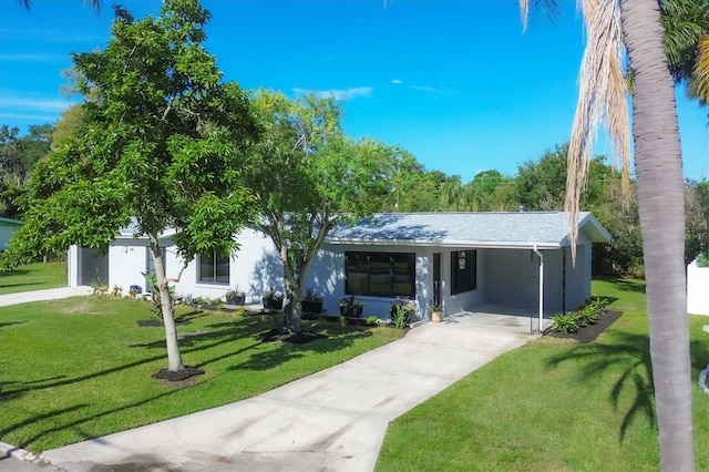 ranch-style home with a front yard and a carport