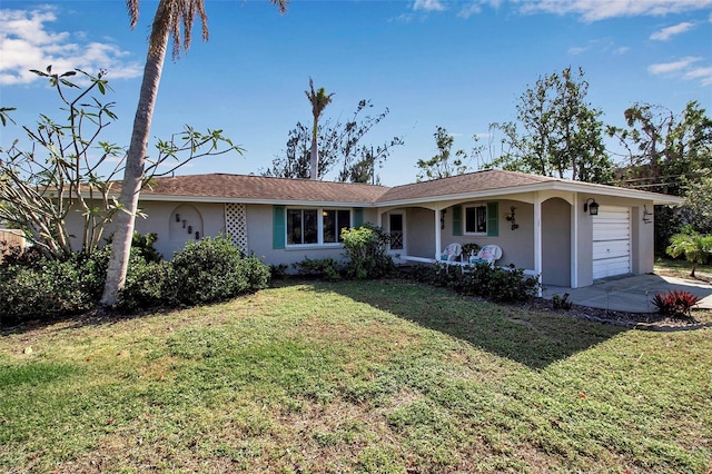 single story home featuring a front yard and a garage