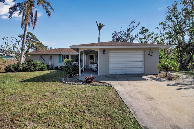 single story home with a garage and a front lawn