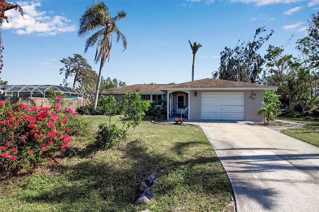 single story home with a garage and a front lawn