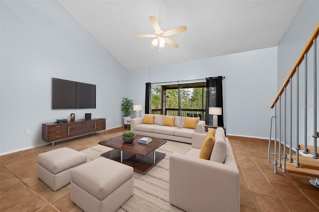 tiled living room featuring high vaulted ceiling and ceiling fan