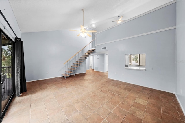 unfurnished living room with high vaulted ceiling, ceiling fan, and light tile patterned flooring