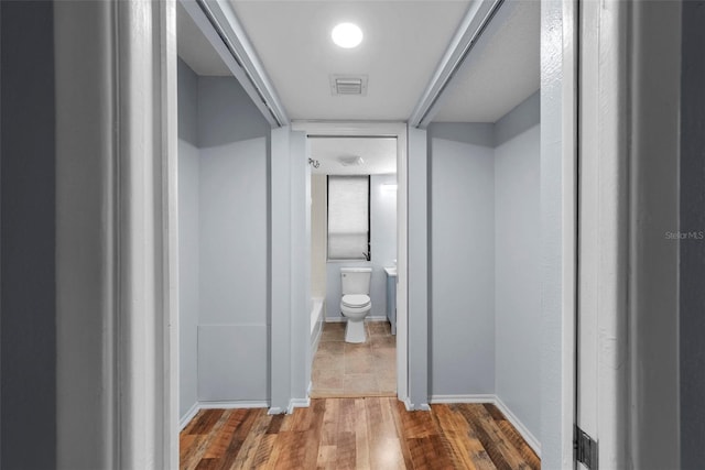 hallway featuring hardwood / wood-style flooring