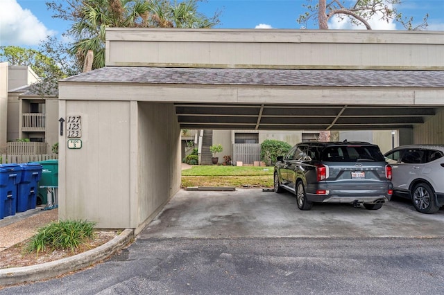 view of vehicle parking with a carport