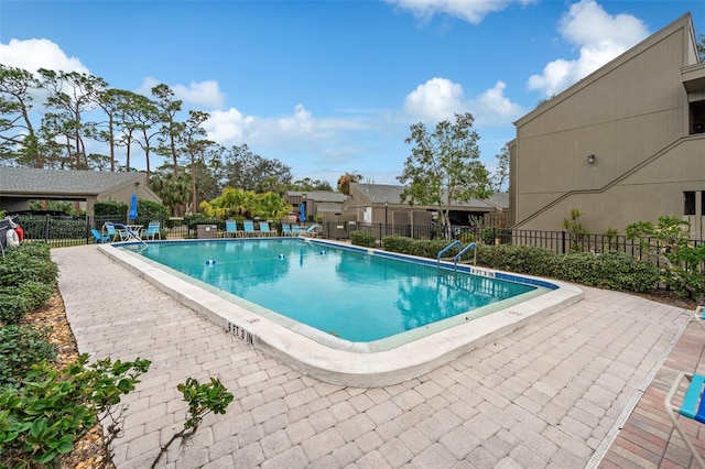 view of swimming pool featuring a patio