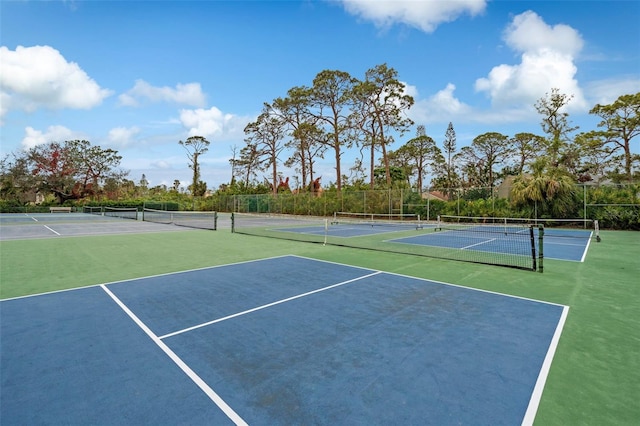 view of tennis court featuring basketball court