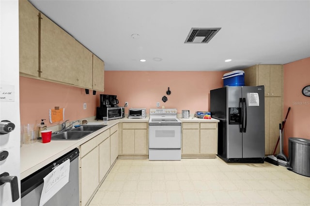 kitchen featuring light brown cabinets, sink, and stainless steel appliances