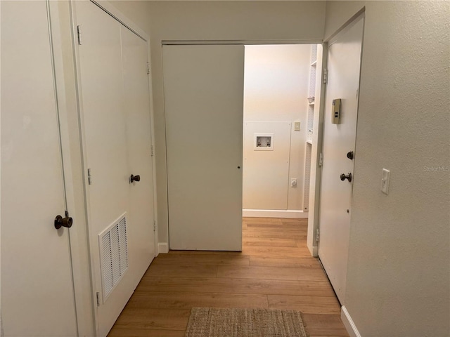 hallway featuring light hardwood / wood-style floors