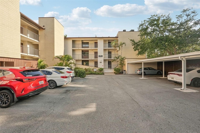 2753 Orchid Oaks Dr Unit 104, Sarasota, FL 34239 - view of partially covered parking lot