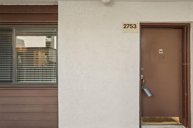 2753 Orchid Oaks Dr Unit 104, Sarasota, FL 34239 - entrance to property featuring stucco siding
