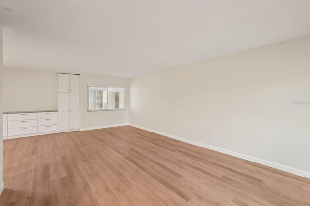 2753 Orchid Oaks Dr Unit 104, Sarasota, FL 34239 - spare room featuring light wood finished floors and baseboards